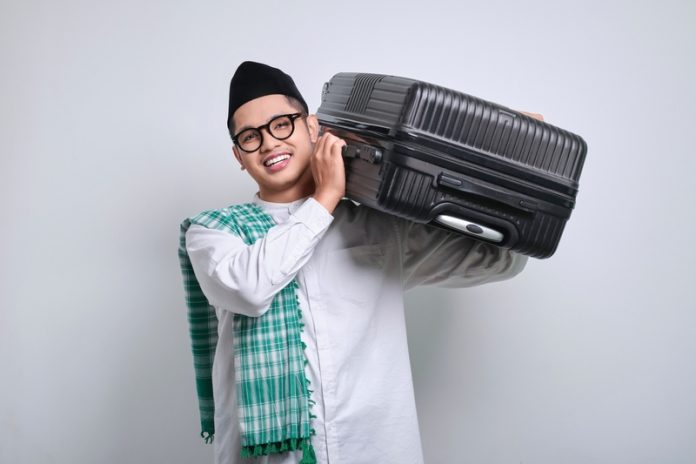 Smiling,Asian,Muslim,Man,In,White,Prayer,Clothes,Standing,Over