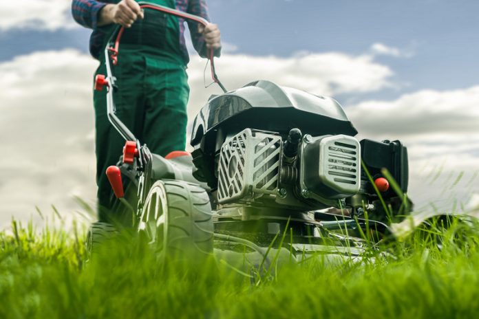 Man,With,Lawn,Mower,Mowing,The,Lawn